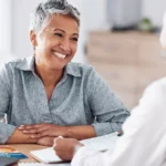 a patient and counselor talking over health concerns