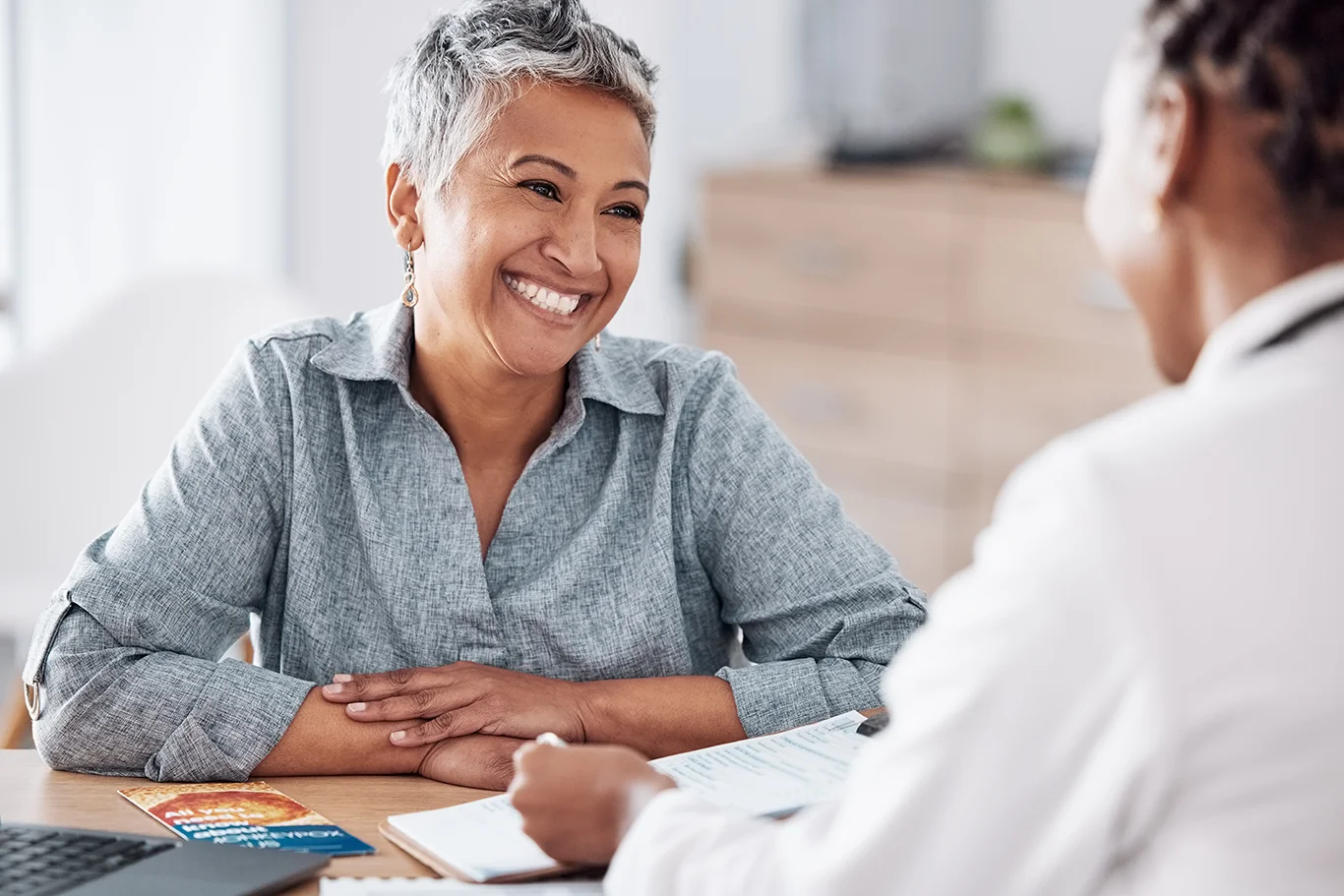 a patient and counselor talking over health concerns